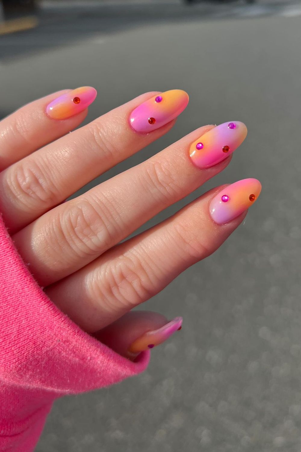 Pink and orange studded nails