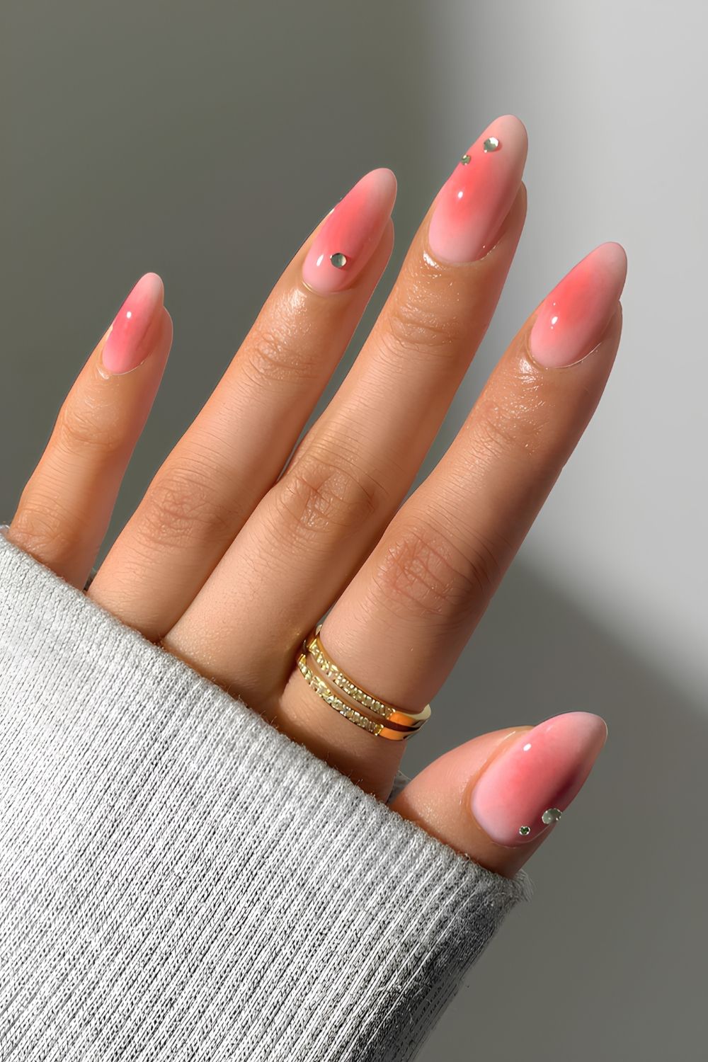 Pink aura manicure with rhinestones