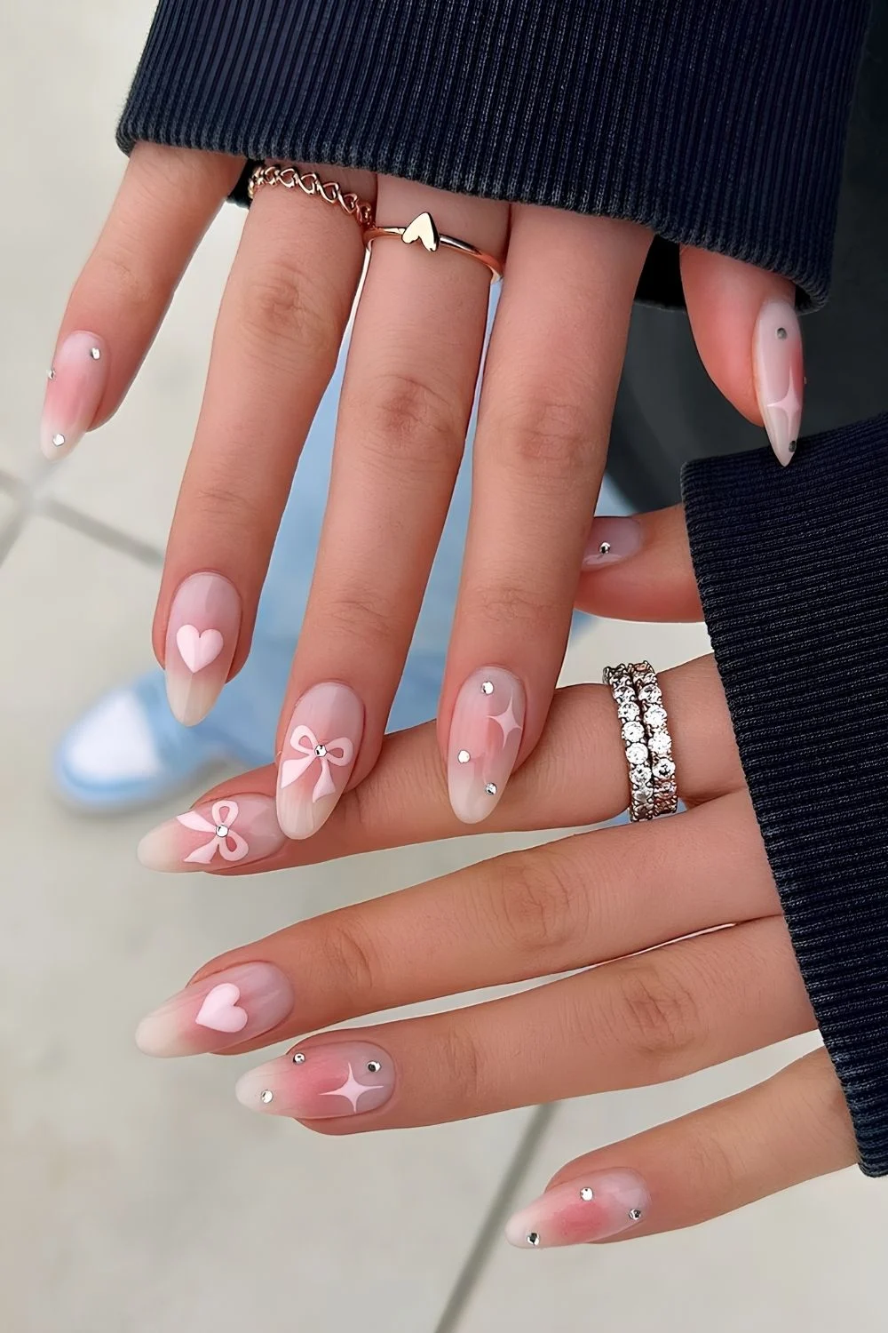 Pink blush nails with bows and stars
