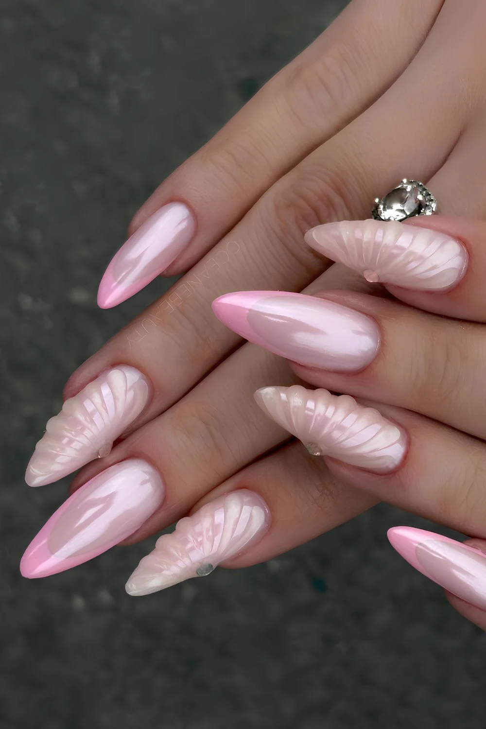 Pink chrome mani with raised shell art
