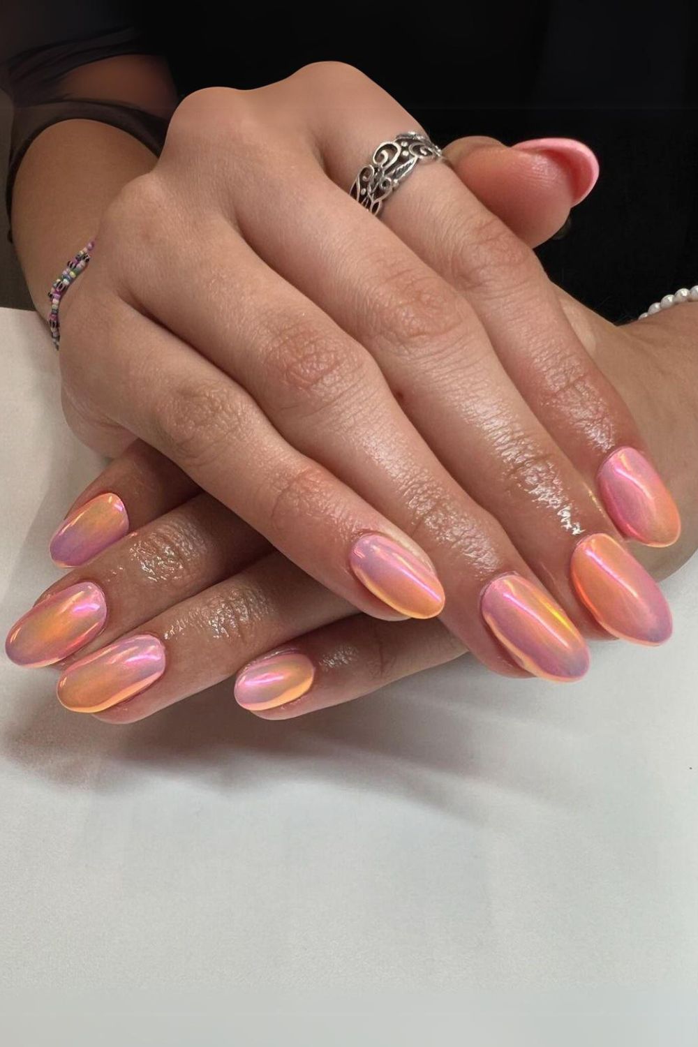 Pink nails with orange chrome finish