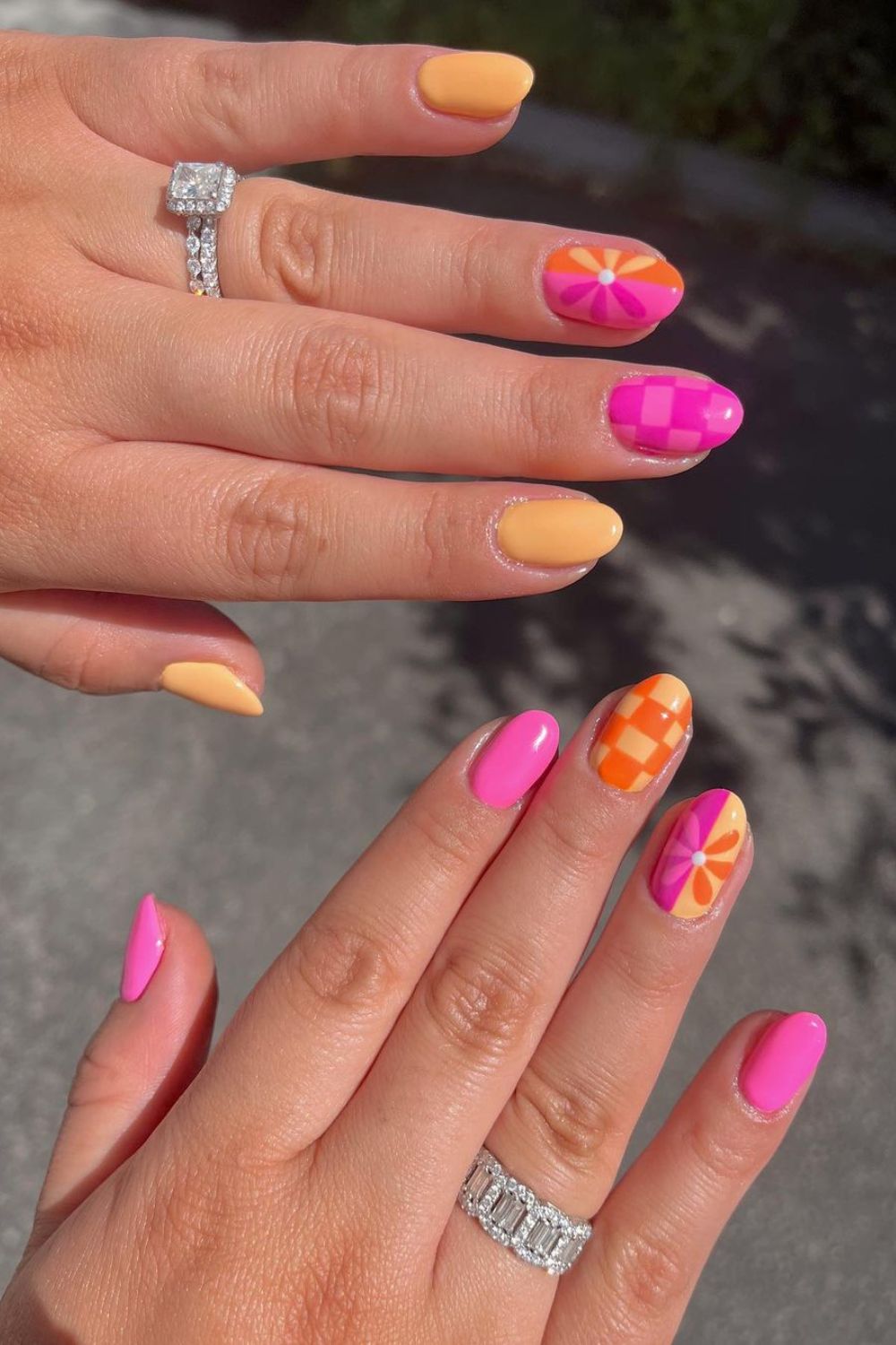 Pink, orange and yellow mismatched nails