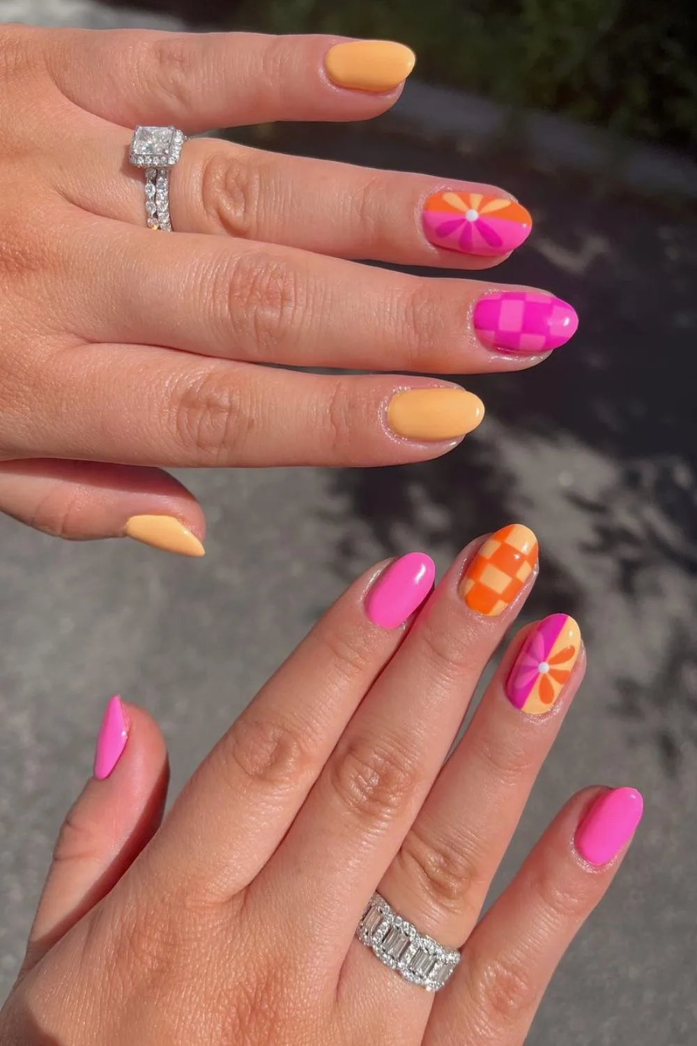 Pink, orange and yellow mismatched nails