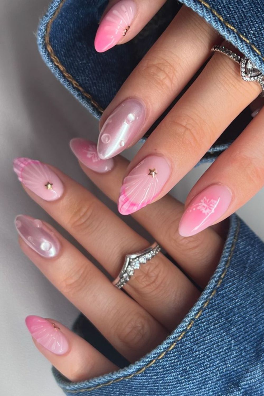 Pink nails with seashell and starfish designs