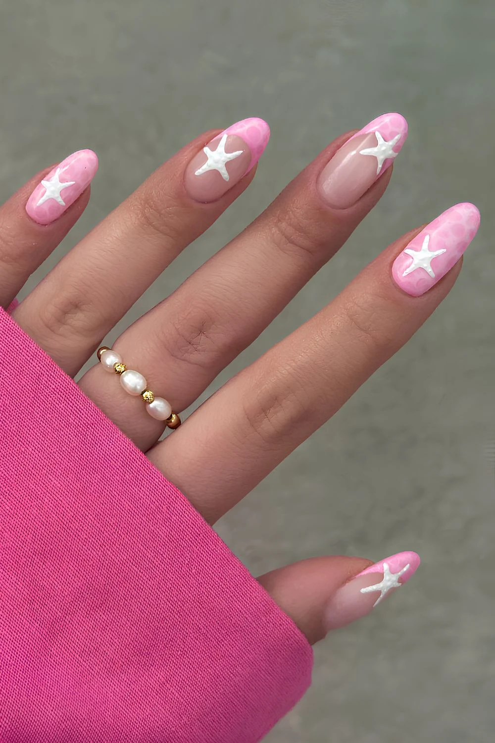 Pink summer nails with white starfish art