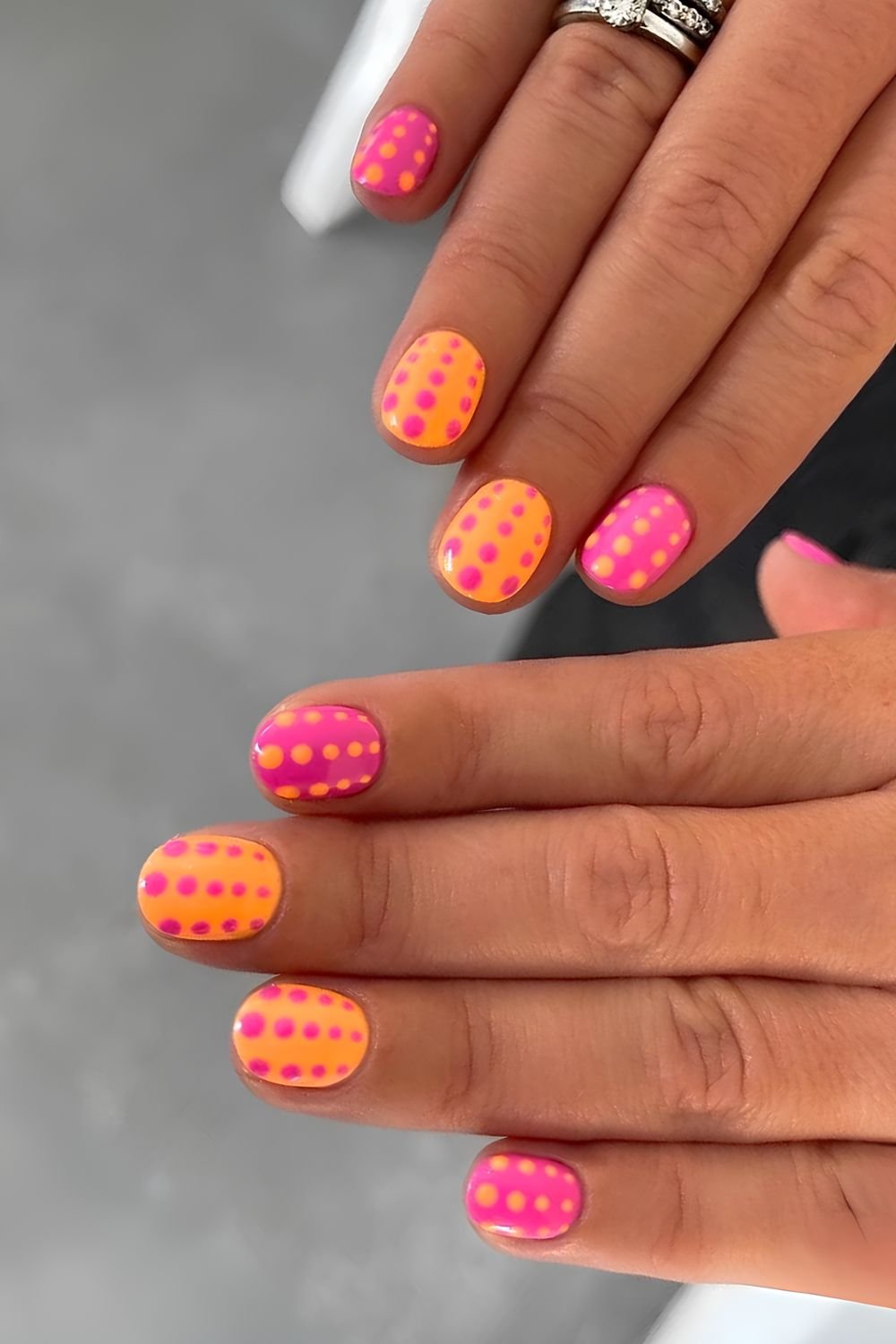 Polka dot orange and pink nails