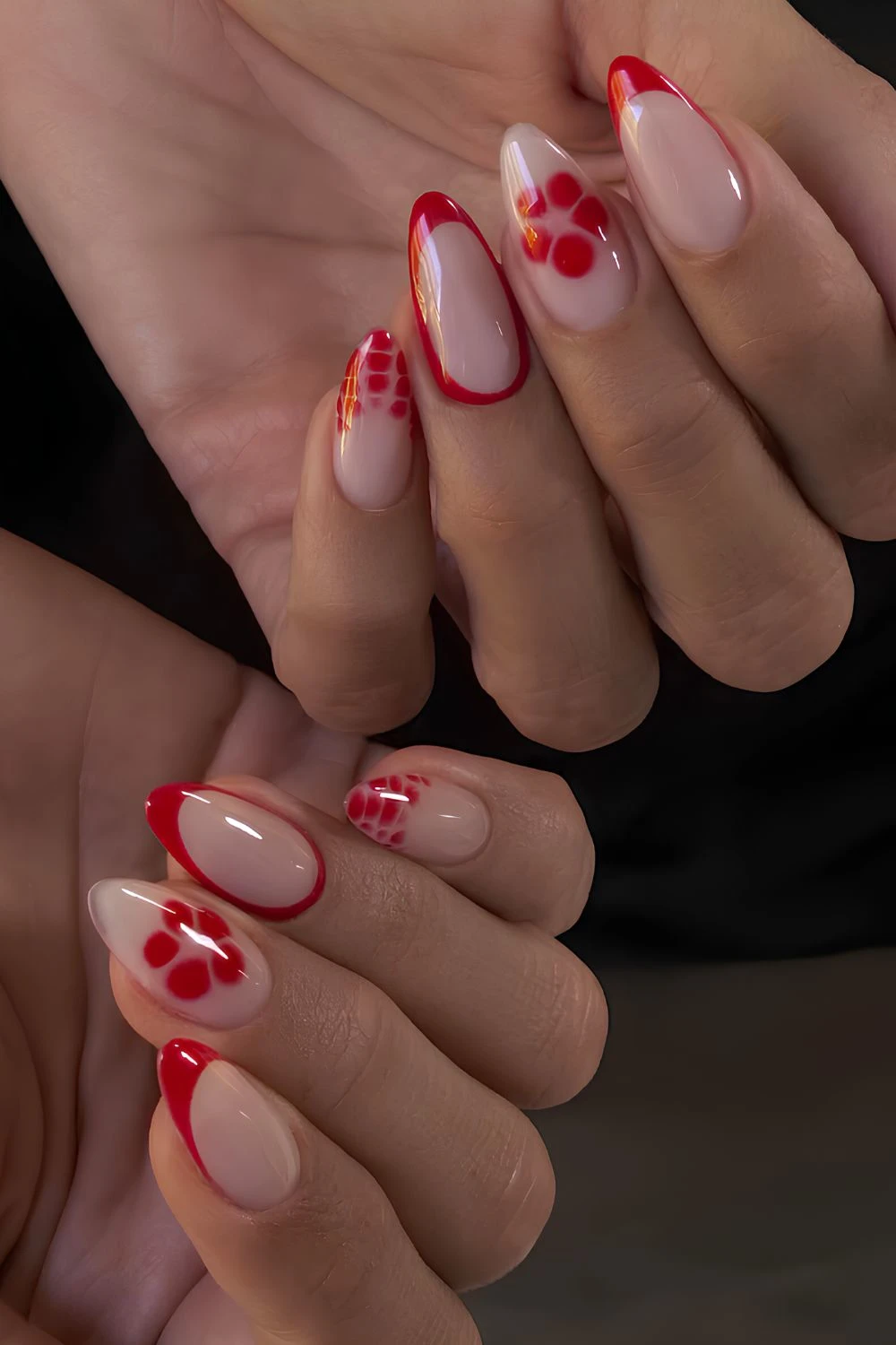 Red French nails with animal print and blooming flowers