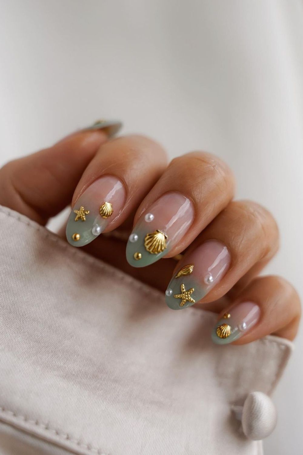 Seafoam green nails with pearls and shells