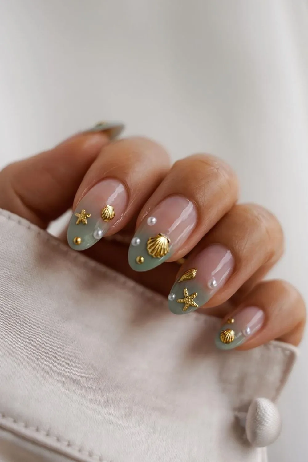 Seafoam green nails with pearls and shells