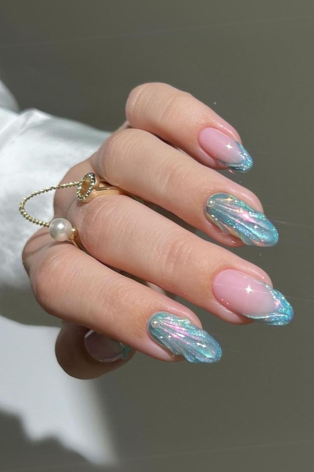 Shimmery blue seashell nails