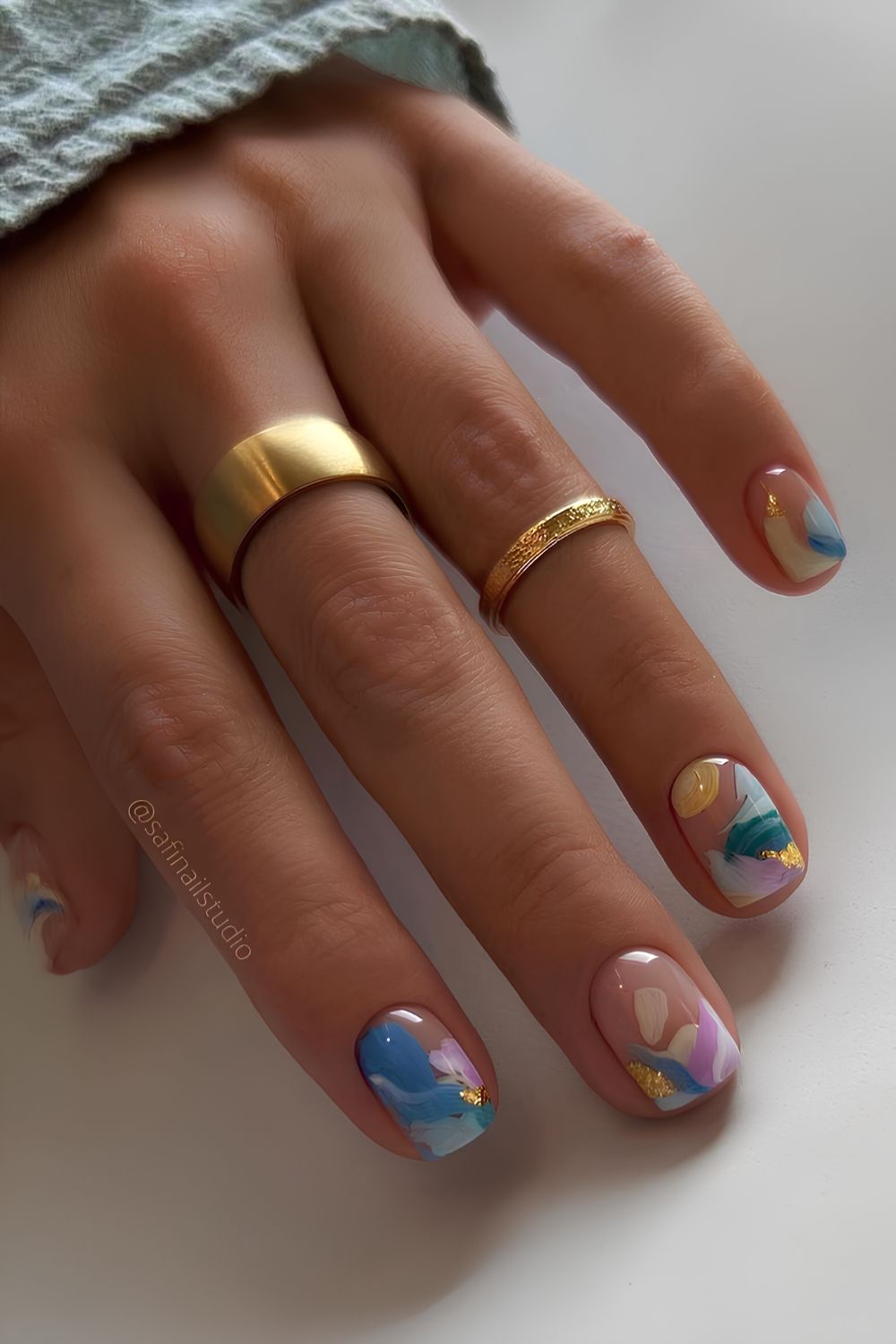 Short blue and yellow abstract summer nails