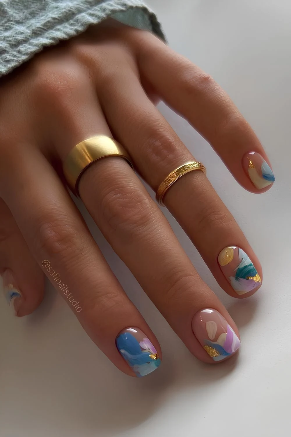 Short blue and yellow abstract summer nails