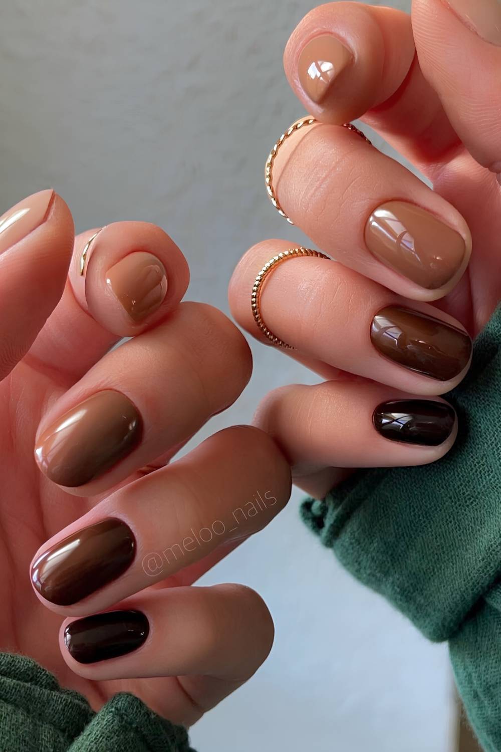Short skittle nails in different brown shades