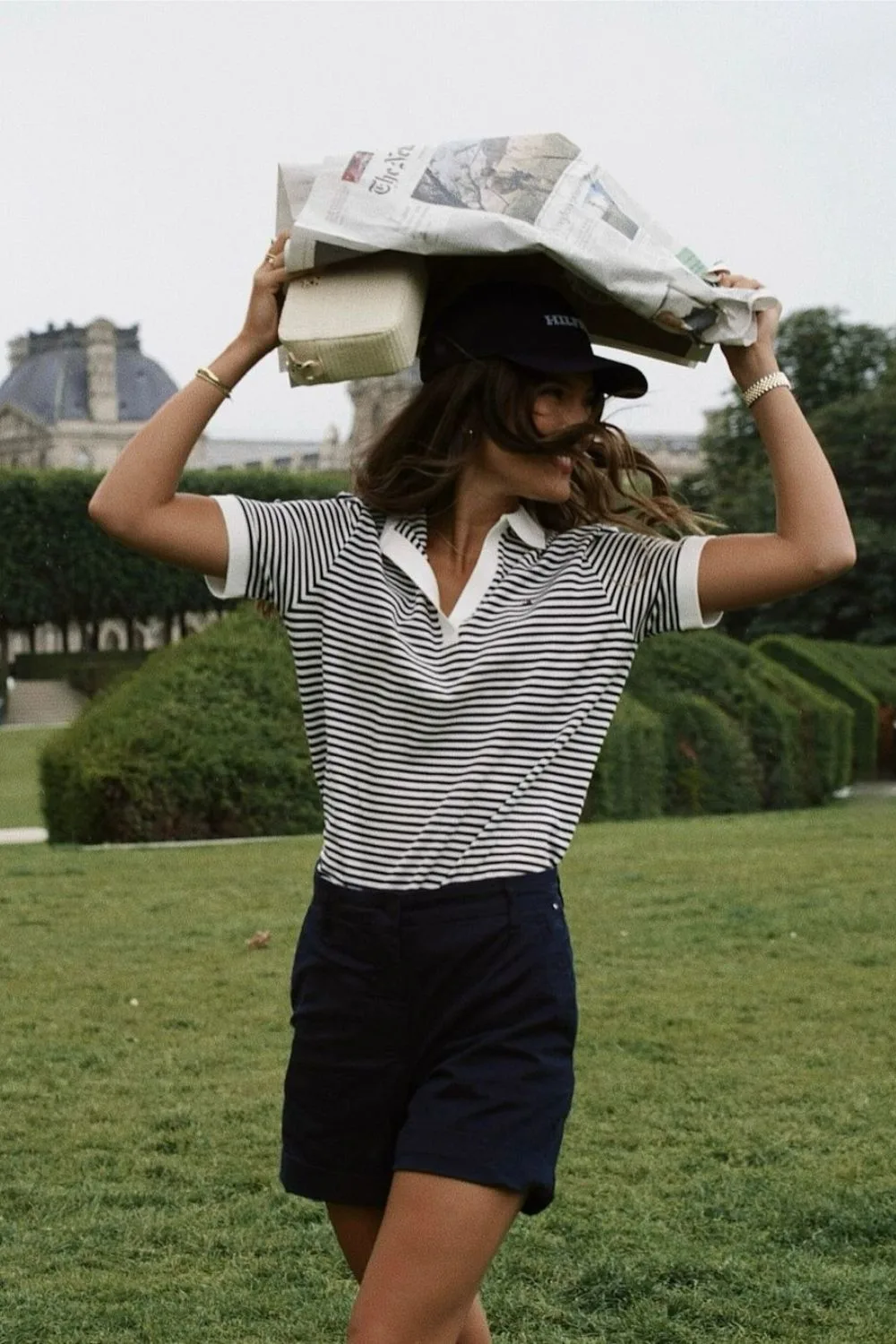 Striped polo shirt and navy blue shorts