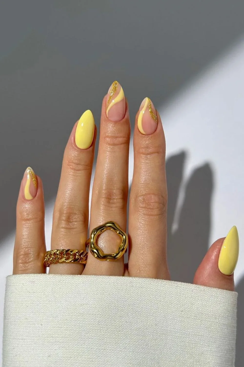 Swirly gold and yellow nail design