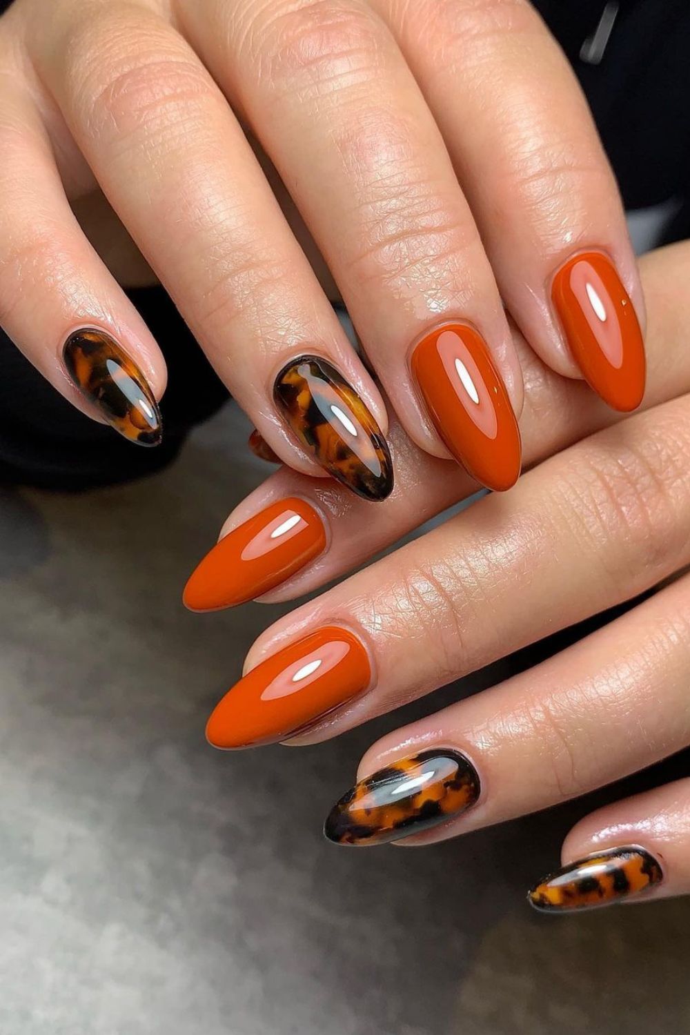 Tortoise and dark orange manicure