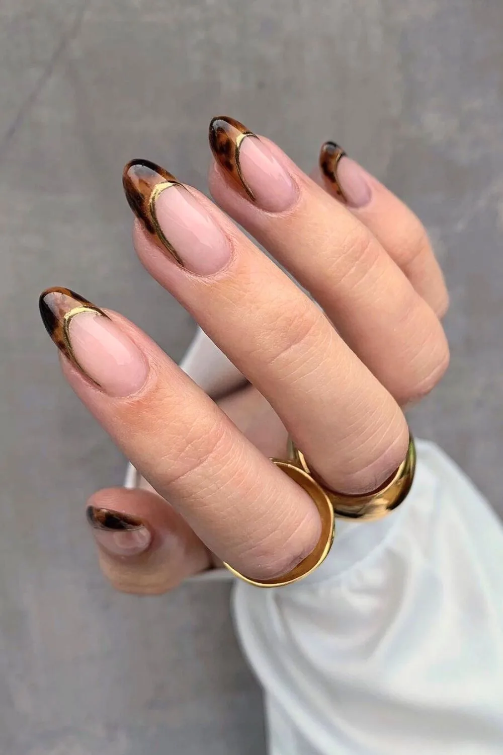 Tortoise shell french tip nails with gold outline