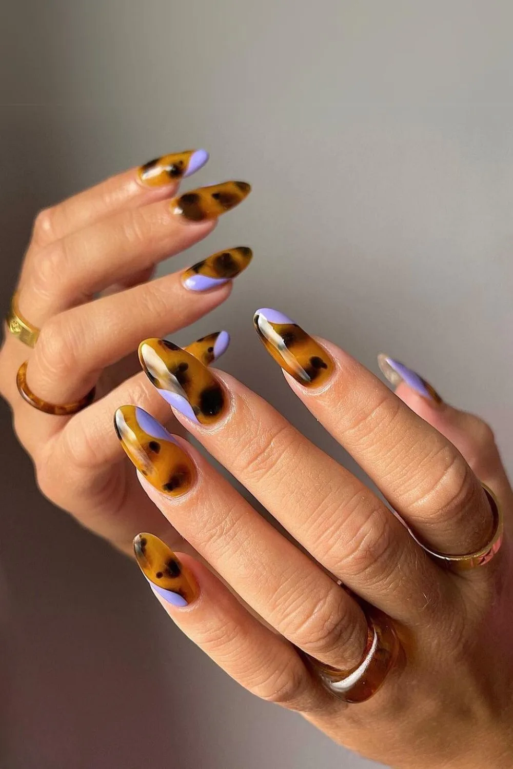 Tortoise shell nails with purple accents