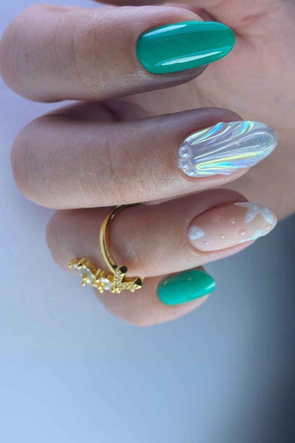 Turquoise nails with white seashell accent