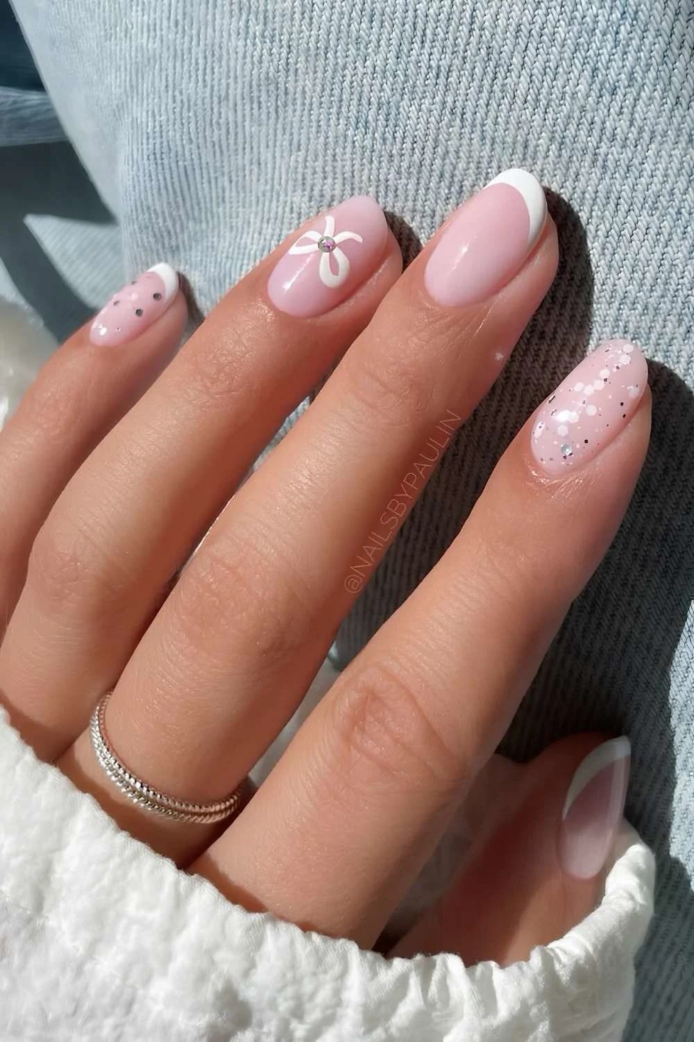 White French mani with bow and glitter accents