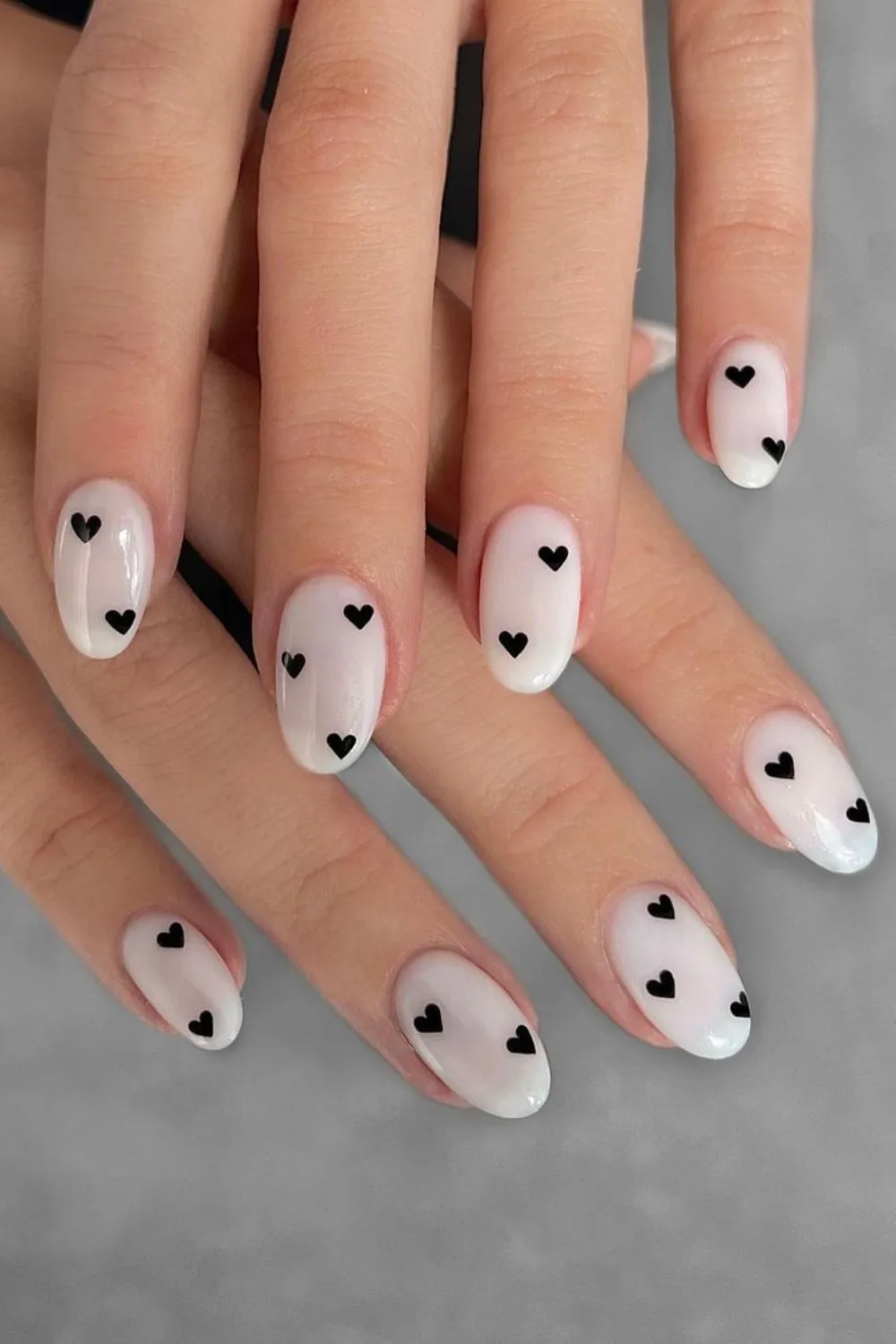 White nails with heart accents