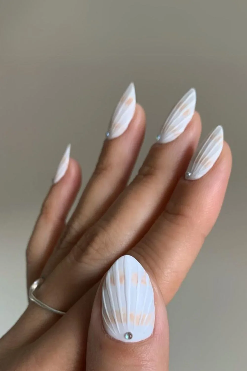 White seashell nails with silver studs