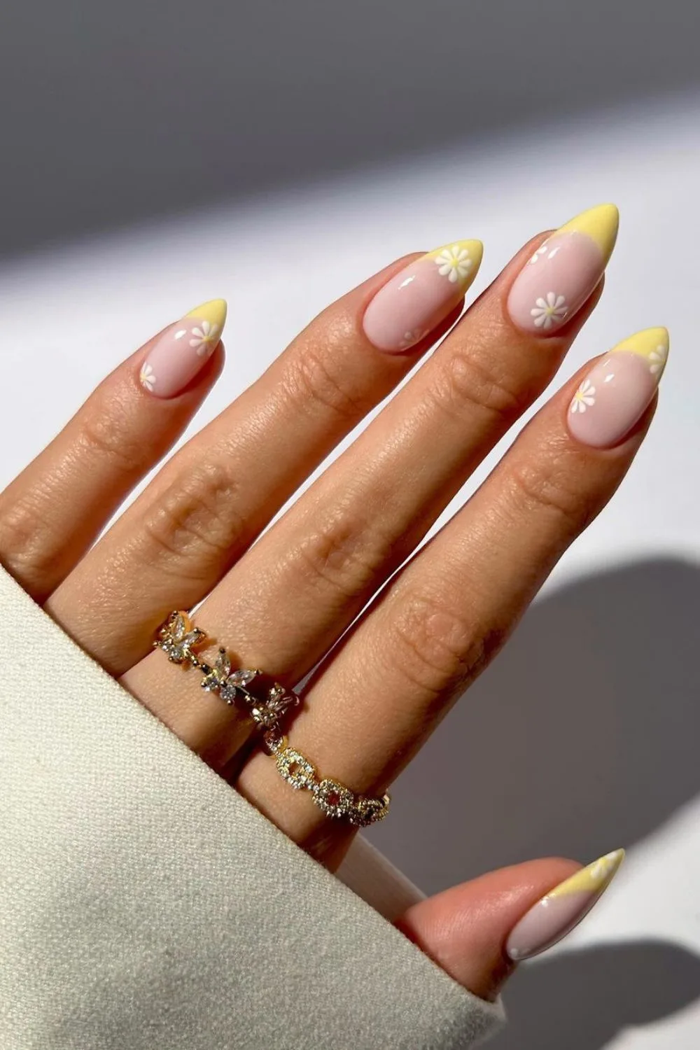 Yellow floral french tip nails