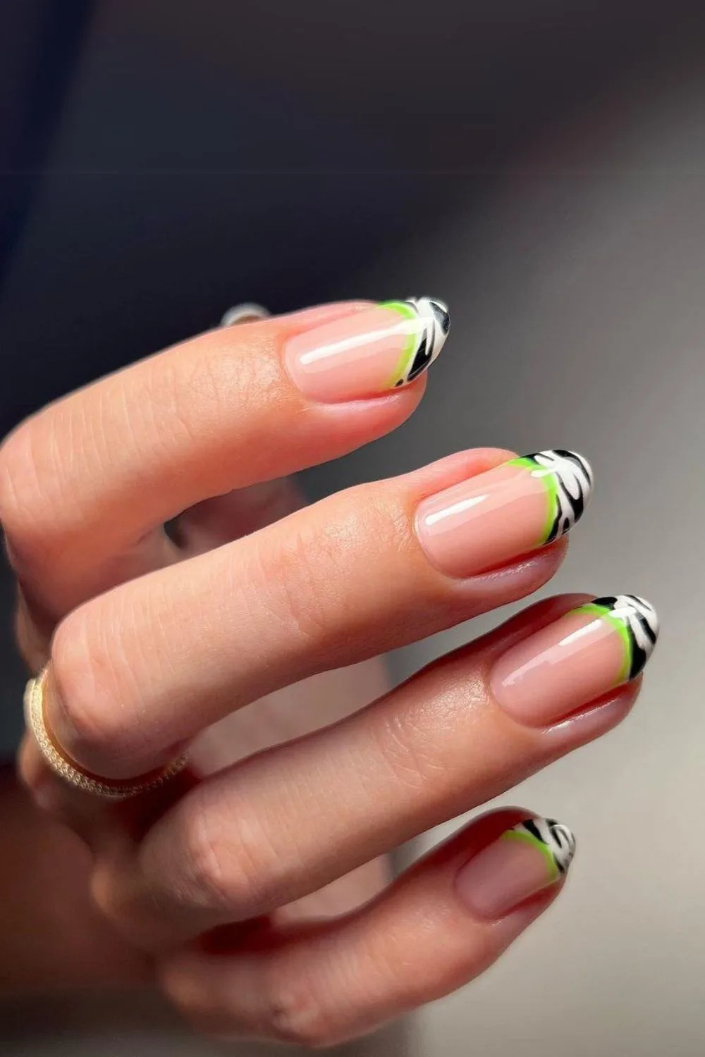 Zebra french tip nails with neon green outline