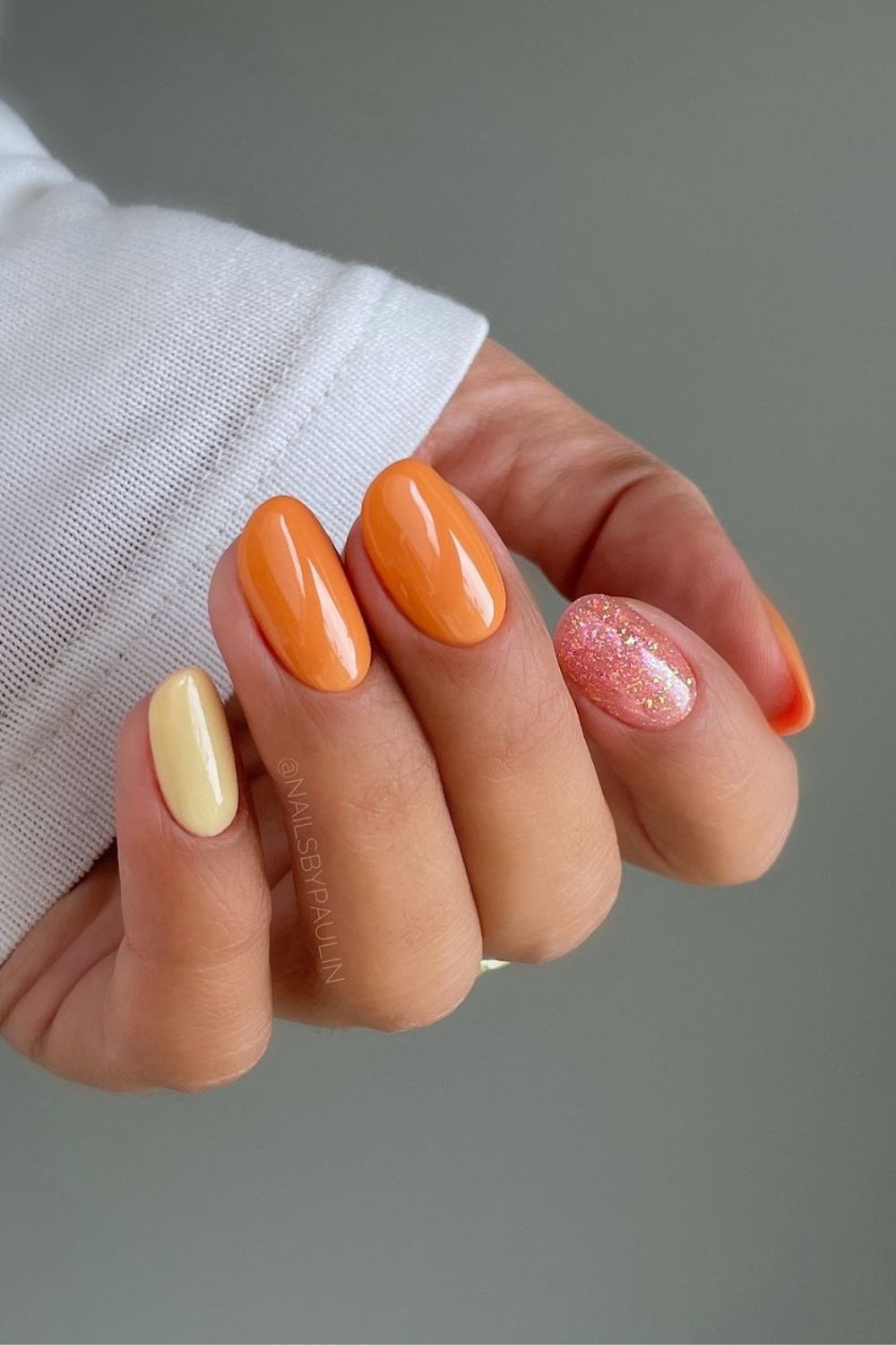 glossy orange with glitter accent