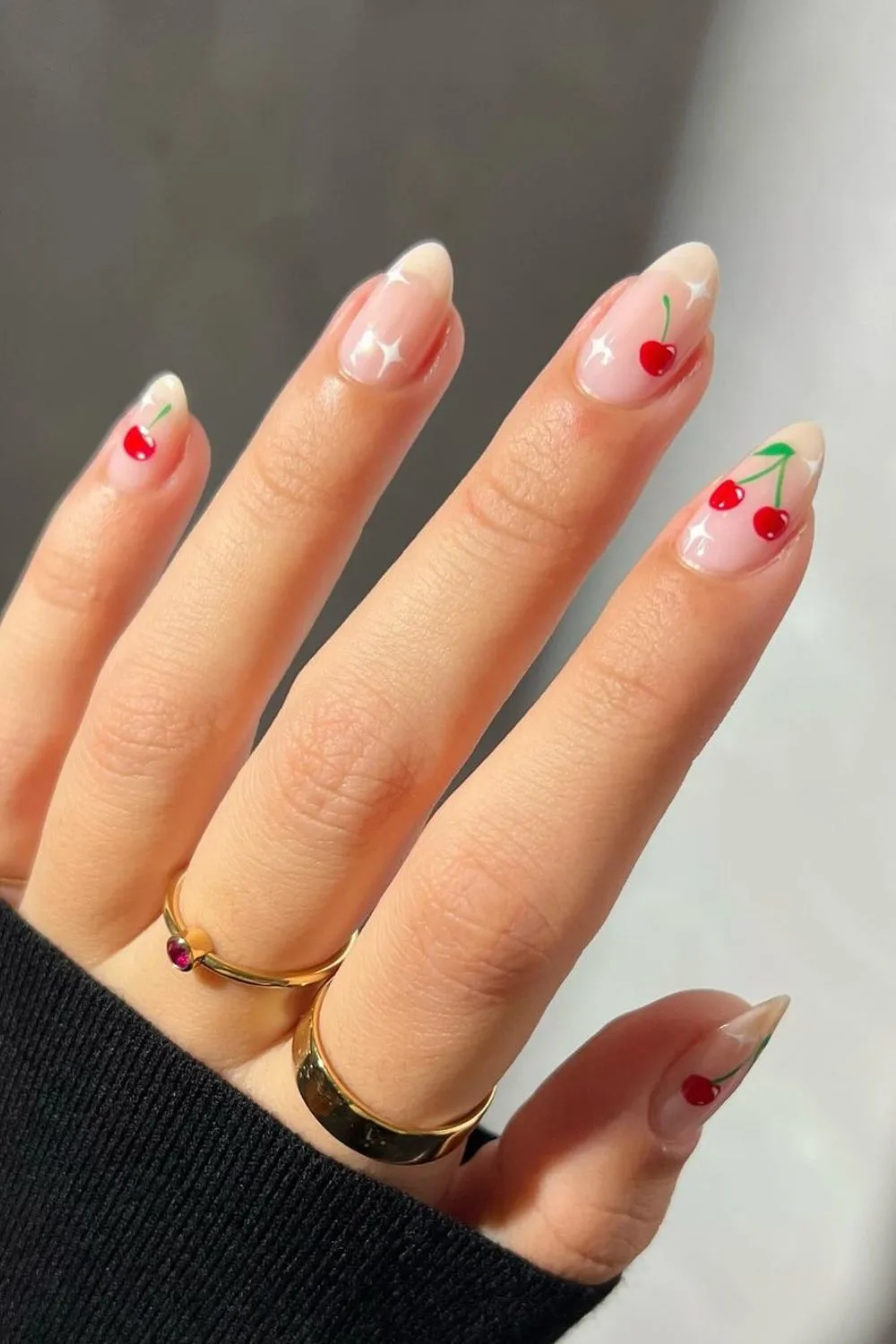 Nude nails with cherries and stars