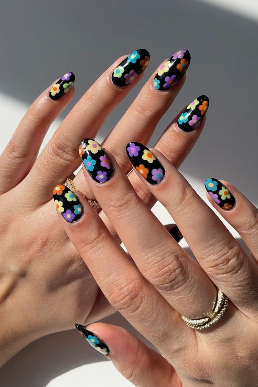 Black nails with colorful flowers