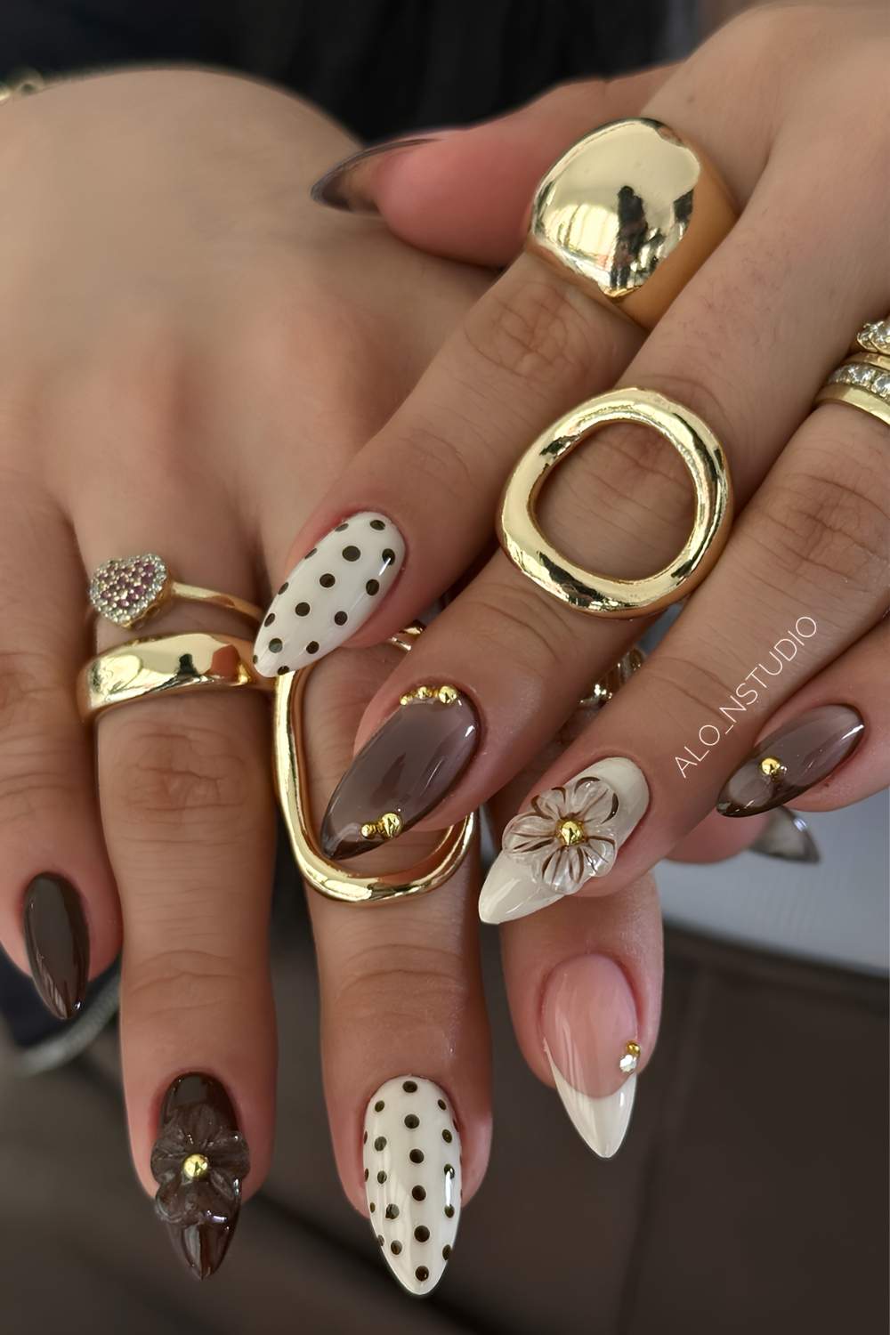 Brown and off white nails with 3d flowers and dots