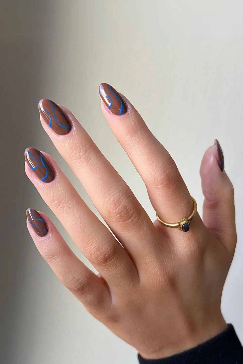 Brown nails with blue waves