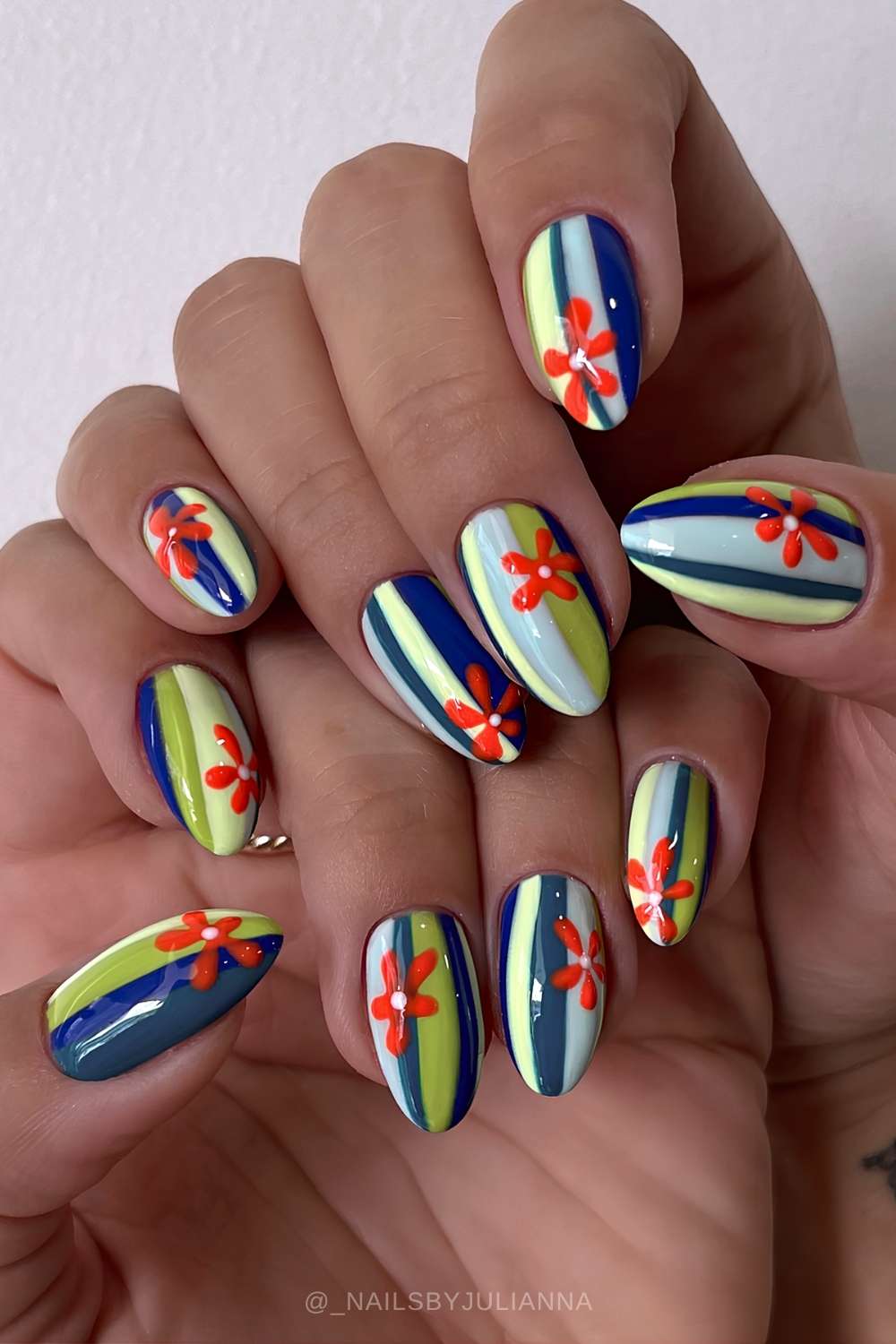 Colorful nails with flowers and funky stripes