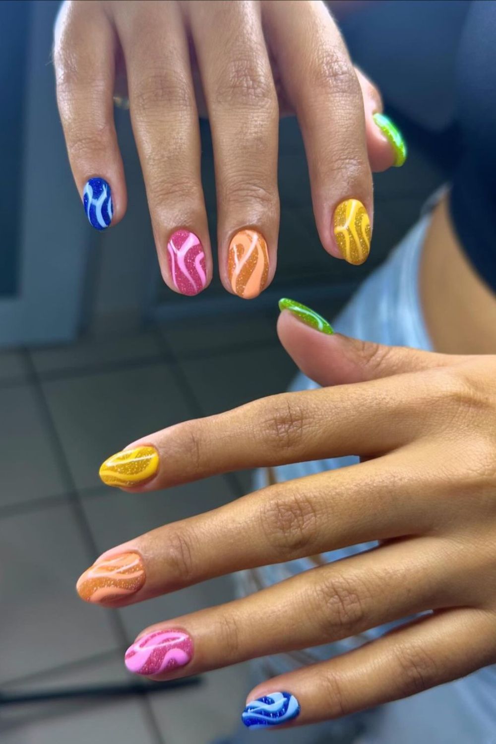 Colorful nails with glittery swirls