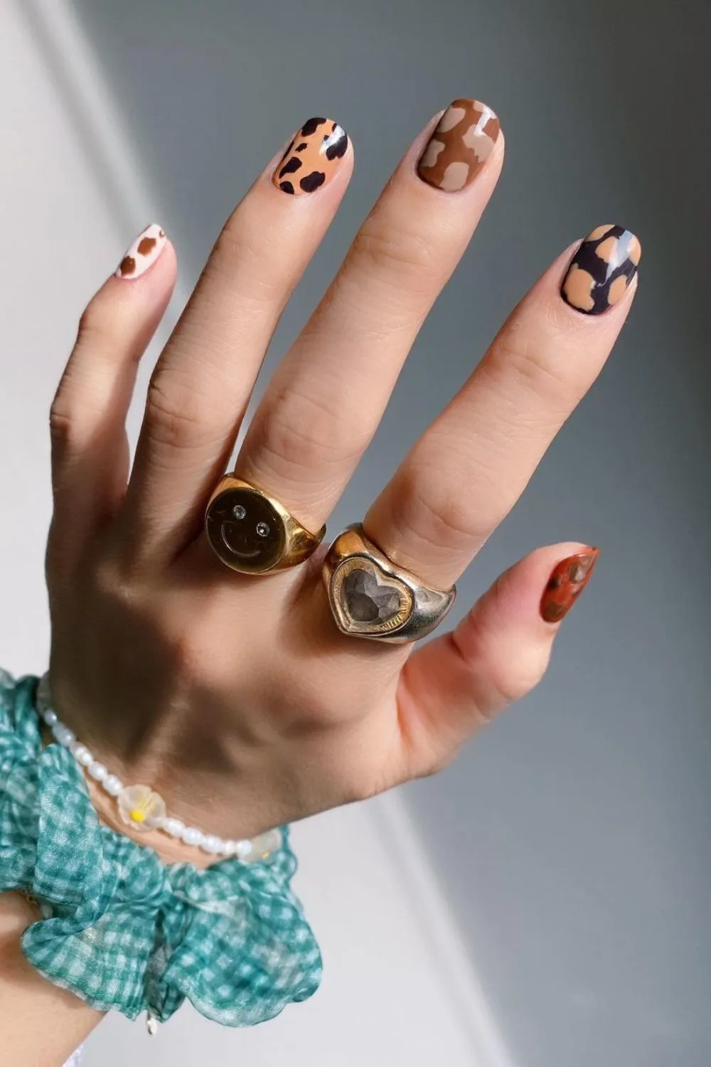 Cow print nails in autumn colors