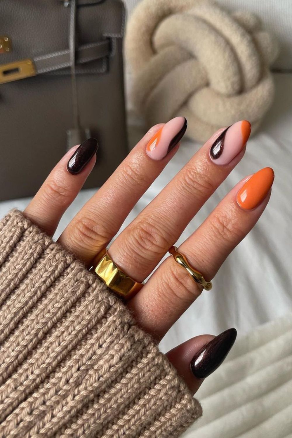 Dark Brown and orange nails with negative space accent