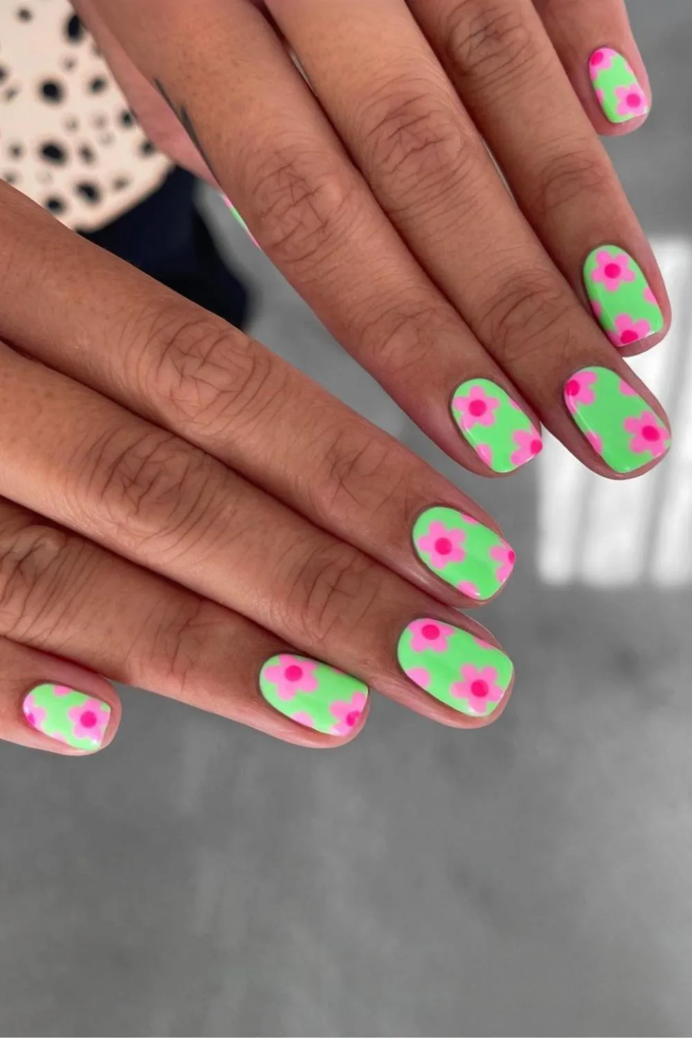 Funky green and pink floral nails