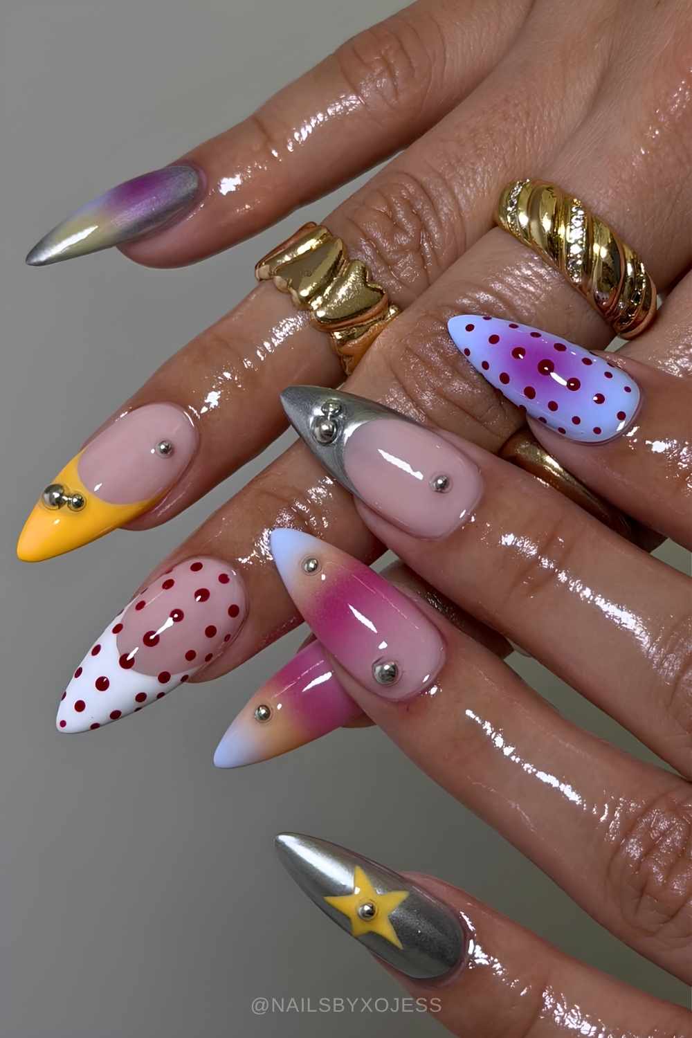 Funky mismatched nails with metallic accents
