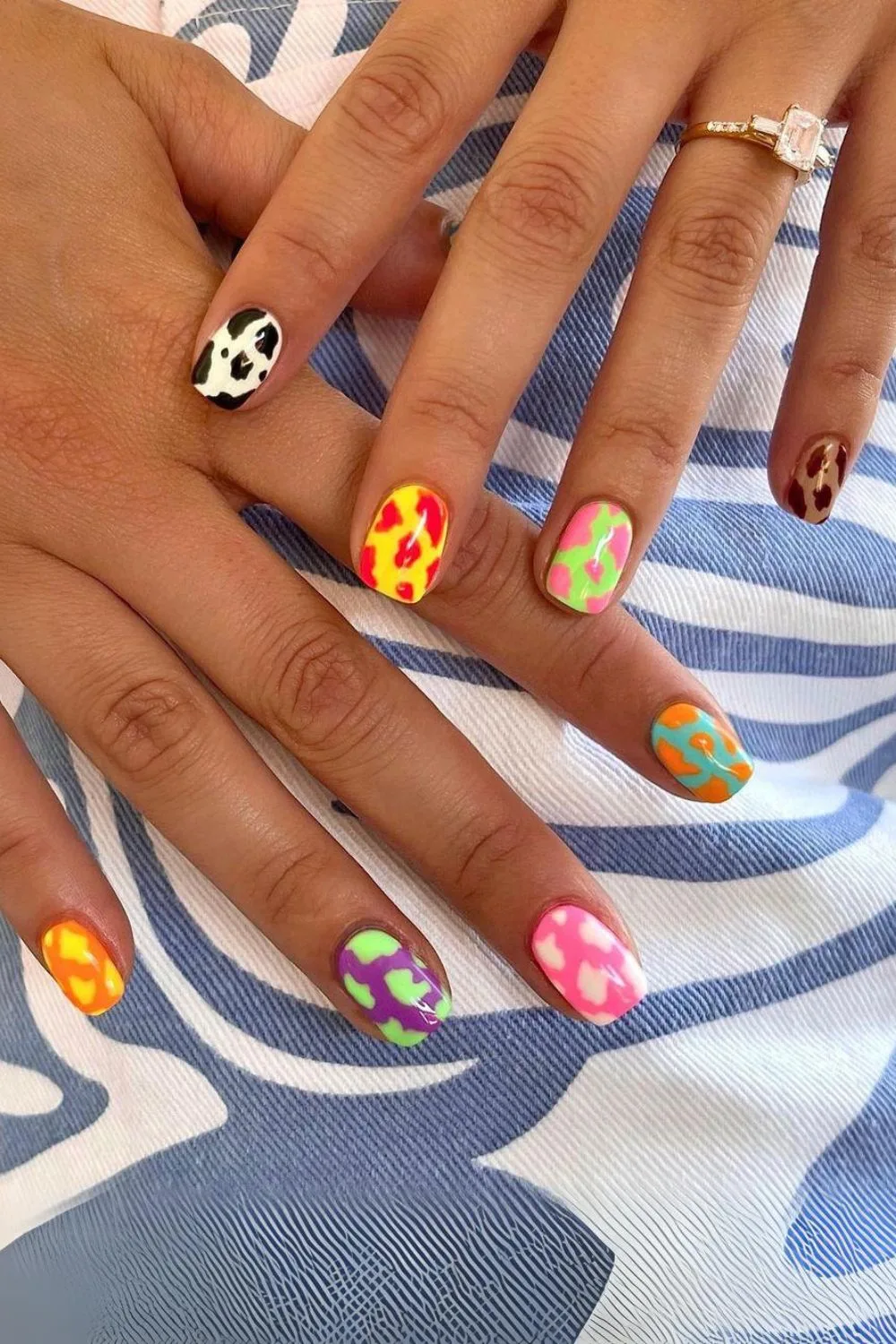 Funky nails with colorful cow print