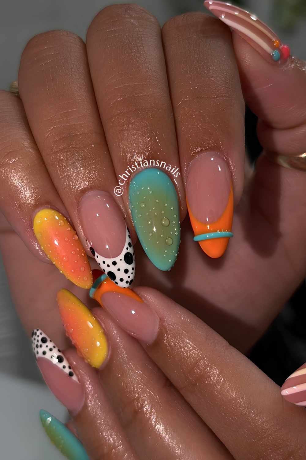 Green and orange mani with aura and dot accents