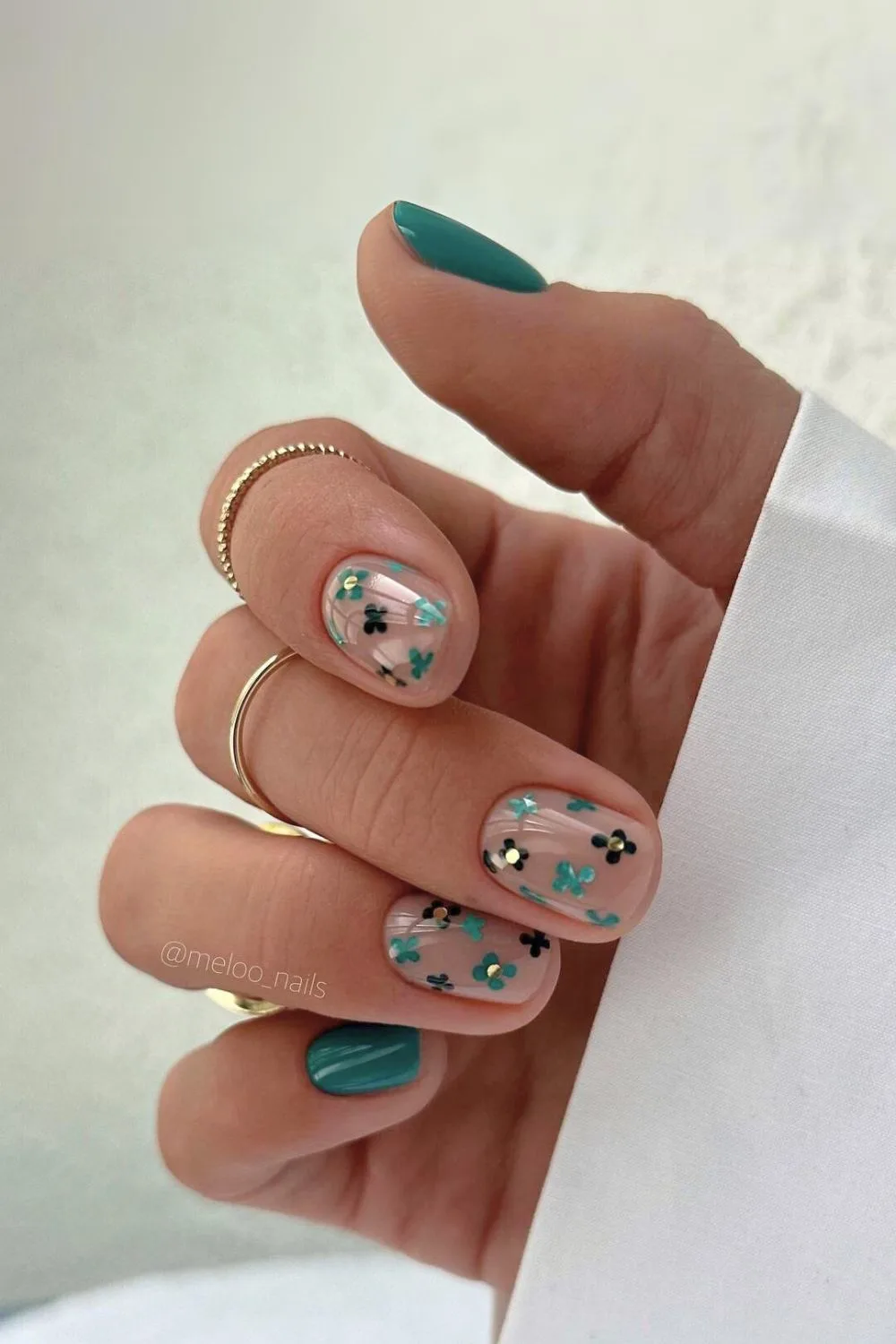 Green floral nails with studs