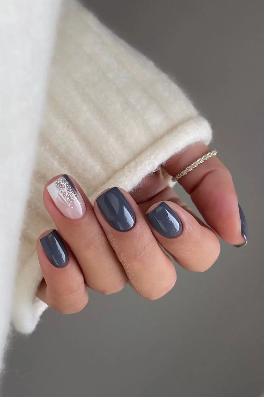 Grey nails with glitter accent