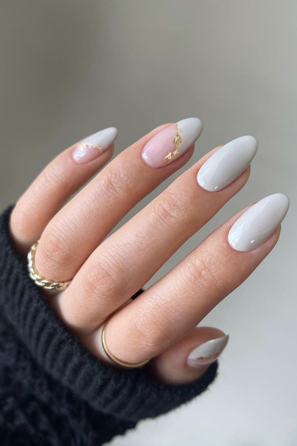 Light gray nails with gold flakes