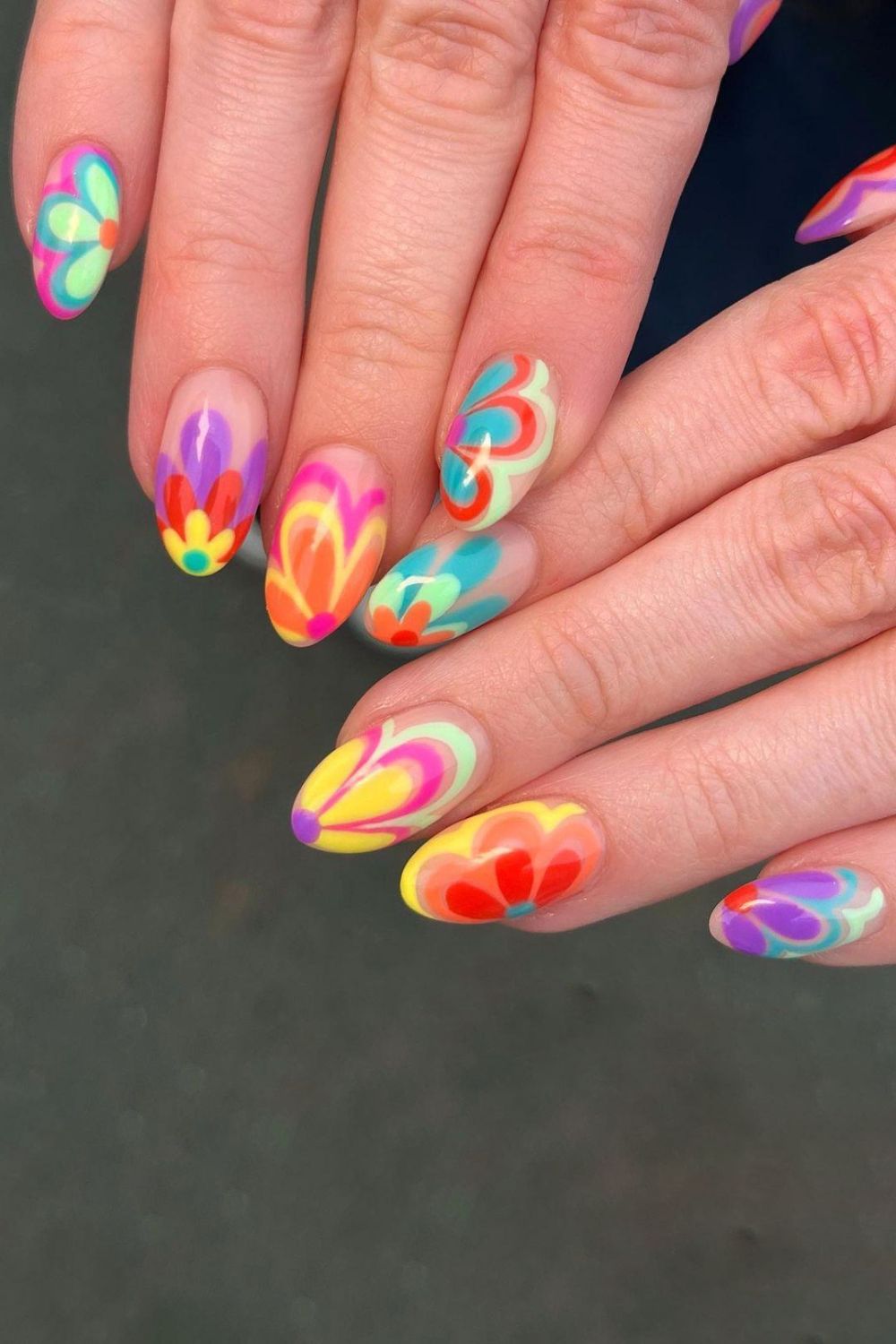 Nails with bold neon floral designs