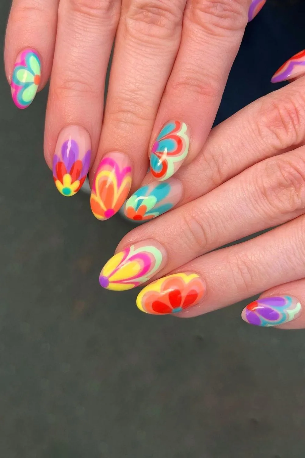 Nails with bold neon floral designs