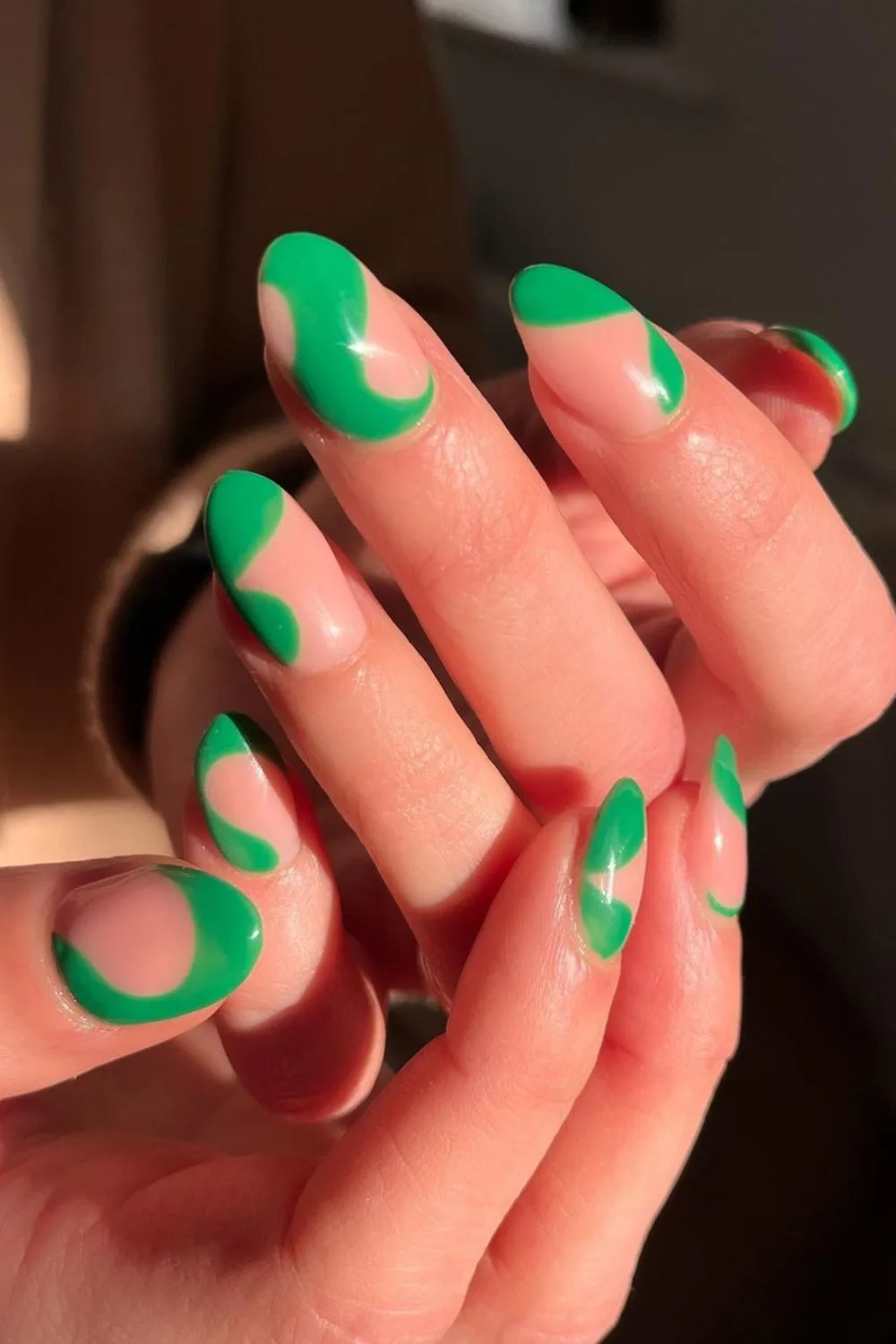 Nails with green swirl accents