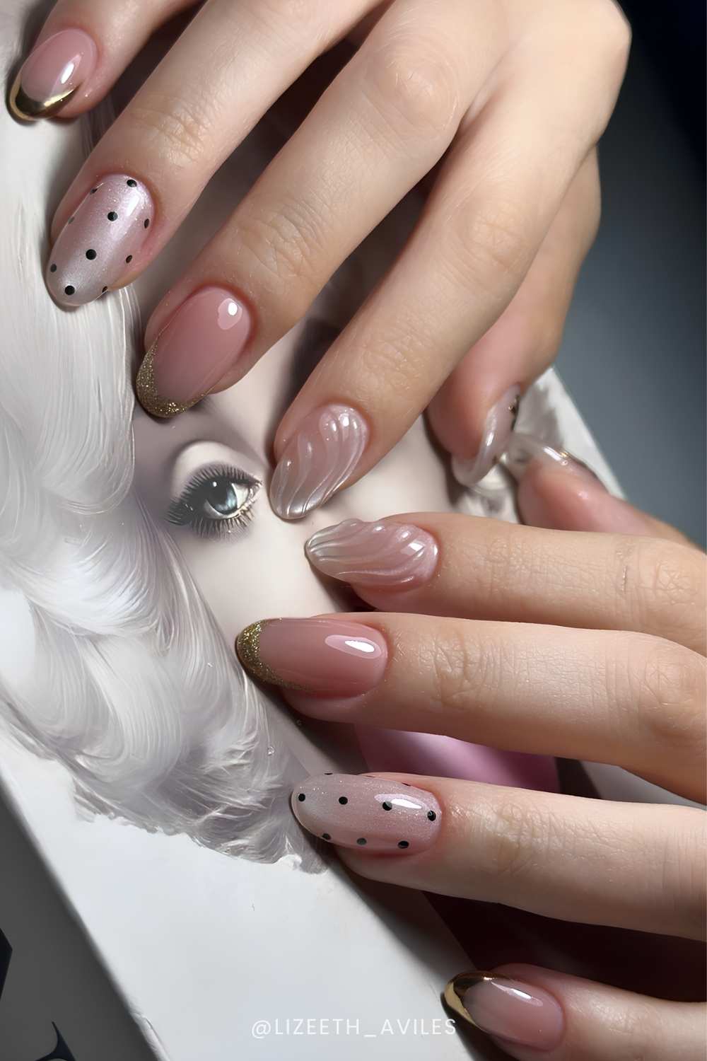 Neutral cat eye nails with polka dot and glitter accents