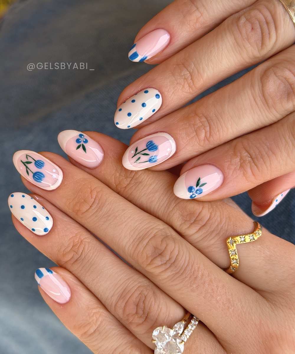 Neutral mani with blue flowers and blueberries