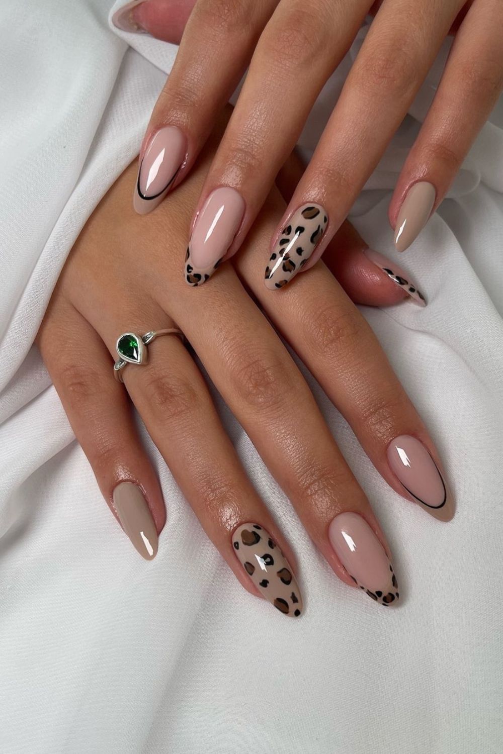 Neutral nails with leopard print accent